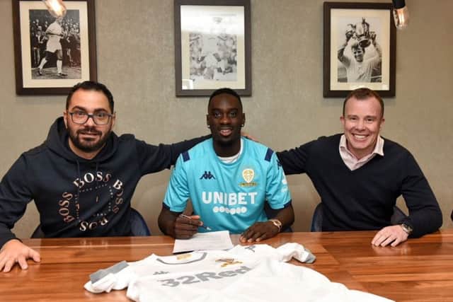 Director of football Victor Orta, left, and chief executive Angus Kinnear, welcome Jean-Kevin Augustin to Leeds United.