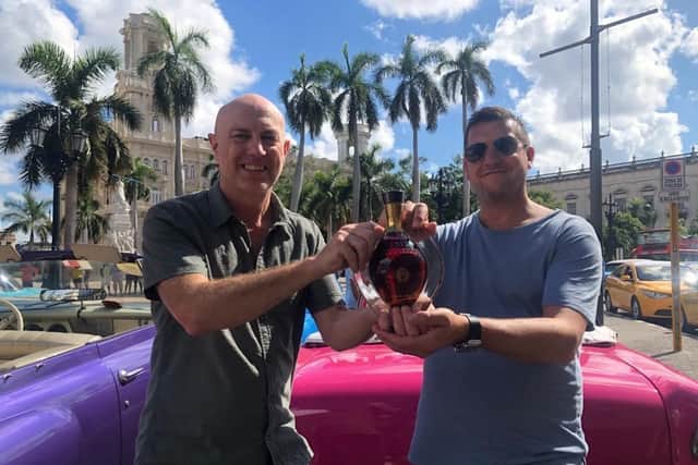 Brad and Adrian with the rum in Havana.