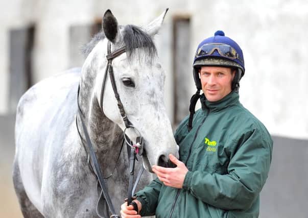 Vintage Clouds with jockey Danny Cook - the Yorkshire-trained horse has been handed a surprising Grand Nationl entry.