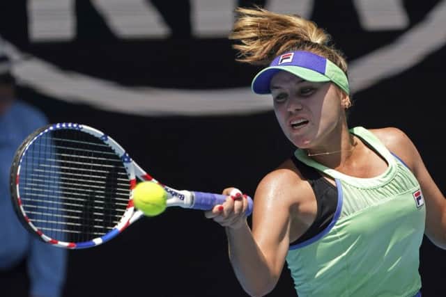 Sofia Kenin makes a forehand return to Tunisia's Ons Jabeur during their quarter-final match at the Australian Open. Picture: AP/Lee Jin-man