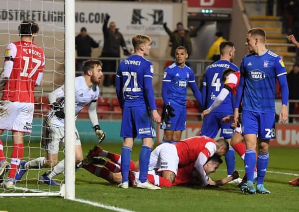 Rotherham captain Richard Wood celebrates his goal on the floor and punches the air.