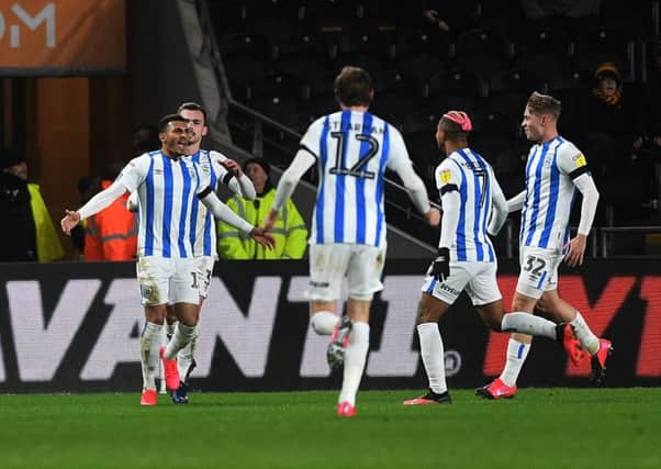 Huddersfield's Karlan Grant celebrates opening the scoring.