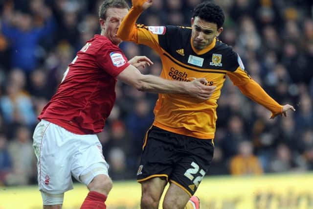 Hull City's Gedo, back in 2013, battles for the ball alongside Nottingham Forest's Danny Collins. (Picture: James Hardisty).