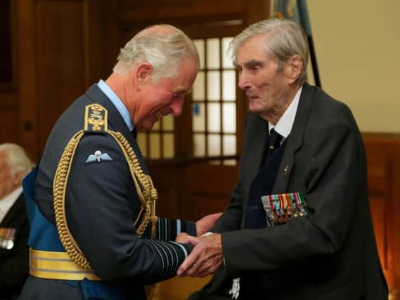 The Prince of Wales talking to Battle of Britain veteran Wing Commander Paul Farnes, who has died aged 101. Credit: Gareth Fuller/PA Wire