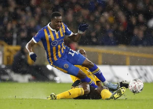INCOMING: Fejiri Okenabirhie, in action for Shrewsbury during an FA Cup fourth round replay match against Wolves at Molineux last February. Picture: Martin Rickett/PA