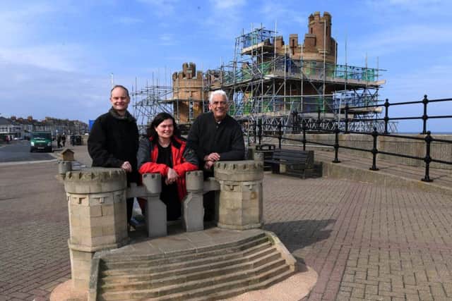 Withernsea Pier and Priomenade Association, from left, Torkel Larson, Rachel Larsen and Sam Watson by the Pier Towers, which have been restored