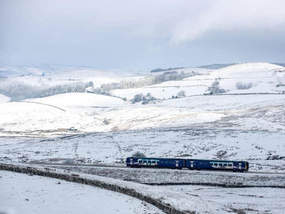A Northern service on the Settle to Carlisle line during heavy snowfall