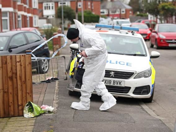 Forensics officers at the scene of the fire on Wensley Avenue on January 25 Picture: Danny Lawson/PA Wire