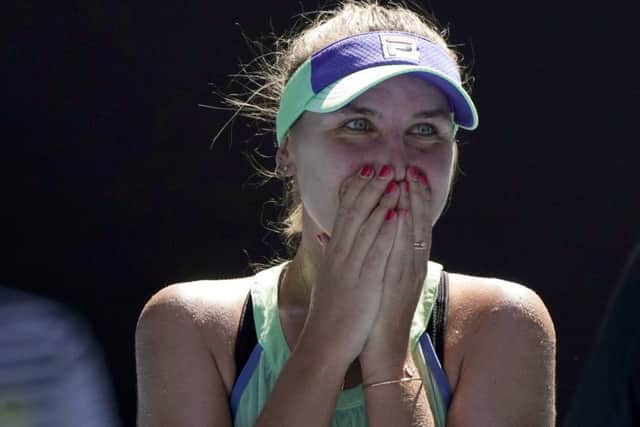 Sofia Kenin of the U.S. reacts as she is interviewed on court after defeating Australia's Ashleigh Barty. (AP Photo/Lee Jin-man)