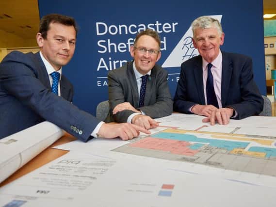 Aviation minister Paul Maynard (centre) at Doncaster Sheffield Airport on Thursday as 10m expansion plans for the terminal were announced. Pictured with Robert Hough (right), Chairman of DSA. Picture: Shaun Flannery