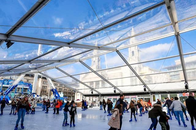A specially covered outdoor real ice rink complete with a transparent marquee style roof