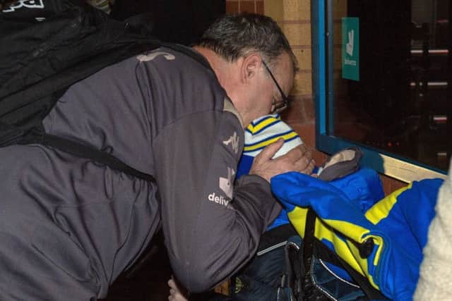Marcelo Bielsa gives a young disabled fan a kiss on his head.
 (Picture: Bruce Rollinson)