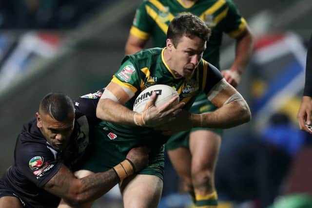 Australia's James Maloney is tackled by New Zealand's Manu Ma'u at Coventry's Ricoh Arena in 2016. Picture: Simon Cooper/PA