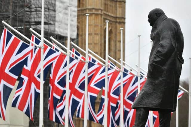 The Winston Churchill statue and Union flags in Parliament Square, London, ahead of the UK leaving the European Union at 11pm on Friday. PA Photo