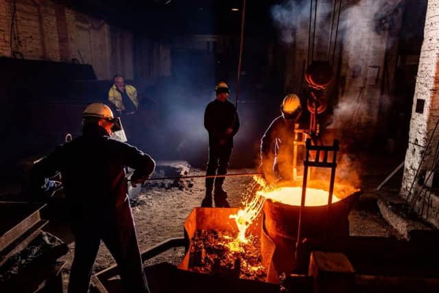 Foundry workers dong their daily jobs at Hargreaves.