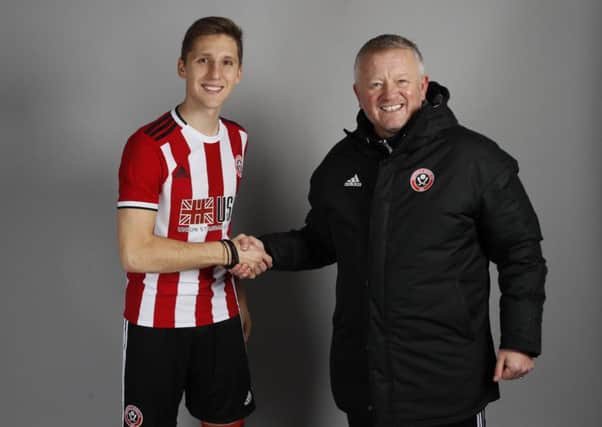 Panagiotis Retsos welcomed by manager Chris Wilder.