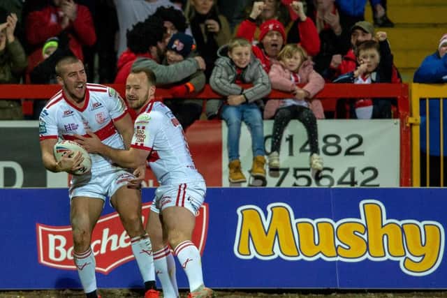 Greg Minkin, left, celebrates with Adam Quinlan after scoring on his Hull KR debut