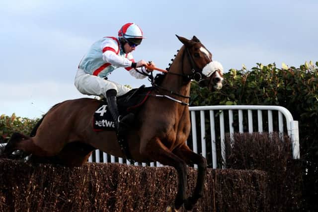 Itchy Feet ridden by jockey Gavin Sheehan goes onto wins the Betway Scilly Isles Novices' Chase at Sandown Park.