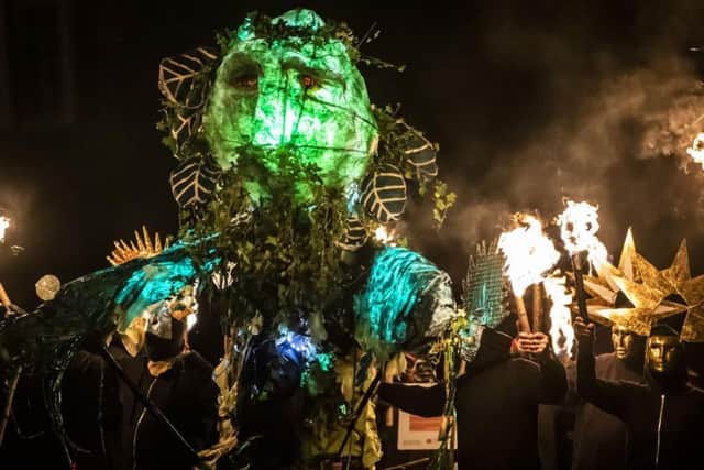 Fire artists with the Green Man during the Marsden Imbolc Fire Festival. Jack Frost and the Green Man battle for supremacy in a mummers play symbolising the triumph of spring over winter. Danny Lawson/PA Wire
