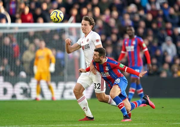 Sheffield United's Sander Berge (left) and Crystal Palace's James McArthur battle for the ball.