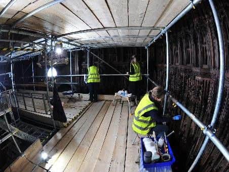 Pictured the restoration team busy at work in the Medieval quire. Picture Gerard Binks