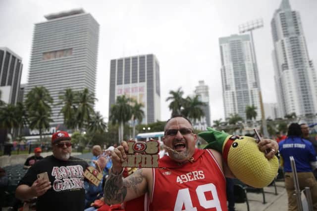 San Francisco 49ers fan Jesse Mendez cheers during a fan rally in Miami. (AP Photo/Brynn Anderson)