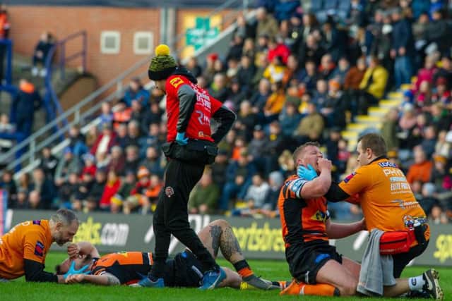 Castleford forwards George Griffin, left, and Adam Milner receive treatment after a clash of heads versus Toronto. (PIC: TONY JOHNSON)