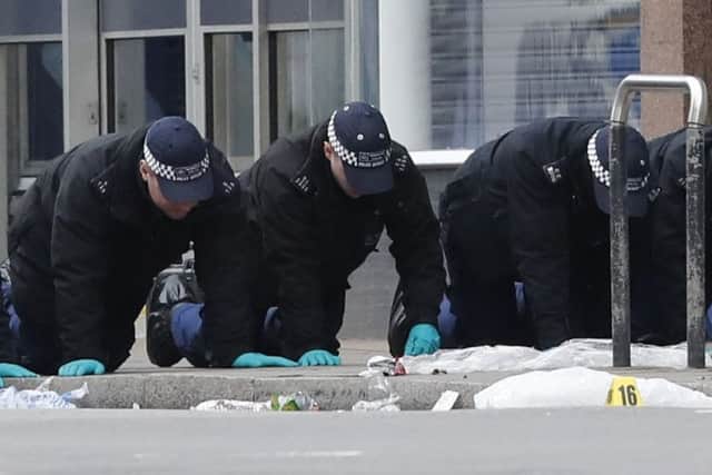 Police conduct a finger tip search following the terror attack in Streatham High Road, south London by Sudesh Amman, 20, who was shot dead by armed police following what police declared as a terrorist-related incident.