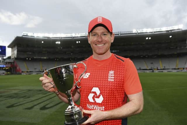England captain Eoin Morgan poses with the T20 trophy for winning the series against New Zealand 3-2 after their match at Eden Park, Auckland. Picture: Andrew Cornaga/Photosport via AP