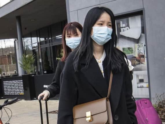 Two women wearing face masks leave the Staycity Hotel in the centre of York. Picture: Danny Lawson/ PA Wire