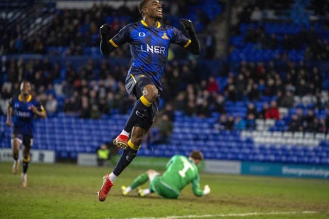 Fejiri Okenabirhie celebrates scoring Doncaster Rovers' third goal.  Pictures: Bruce Rollinson