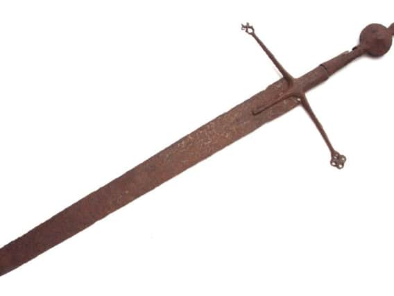 Highlander sword sold at auction at Hutchinson Scott, at Skipton, for 30,000. The sword is believed to date from the 15th or 16th Century and was originally valued at 200. Picture: SWNS