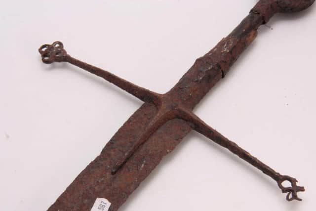 Highlander sword sold at auction at Hutchinson Scott, at Skipton, for 30,000. The sword is believed to date from the 15th or 16th Century and was originally valued at 200. Picture: SWNS