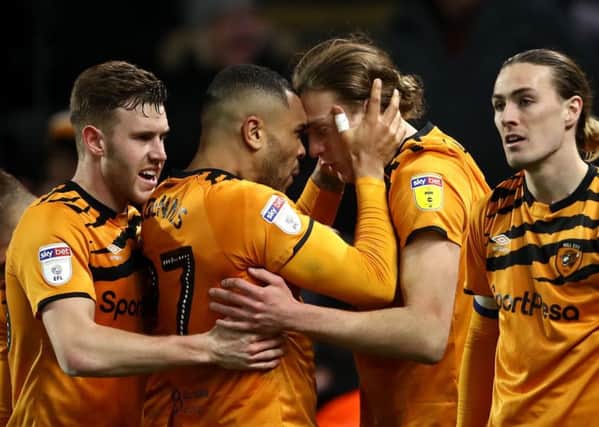 Thriller: Hull City's Tom Eaves, centre right, celebrates scoring his side's fourth goal of the game with team-mate Josh Magennis.