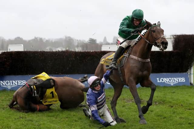 Cyrname ridden by Harry Cobden is a faller in The Betfair Ascot Steeple Chase during Betfair Ascot Chase Raceday at Ascot Racecourse. (Picture: Bradley Collyer/PA Wire.)