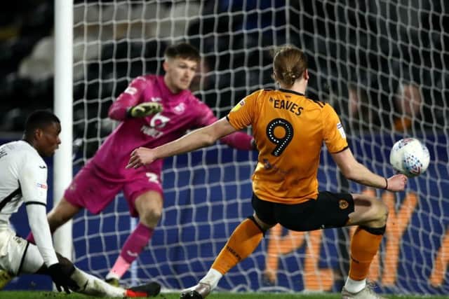 Hull City's Tom Eaves slides in the equaliser against Swansea on Friday (Picture: PA)