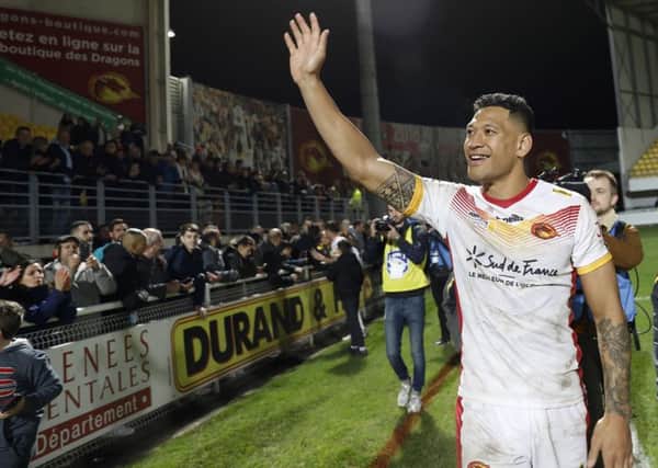 Catalans Dragons' Israel Folau waves to the crowd.  (AP Photo/Joan Monfort)