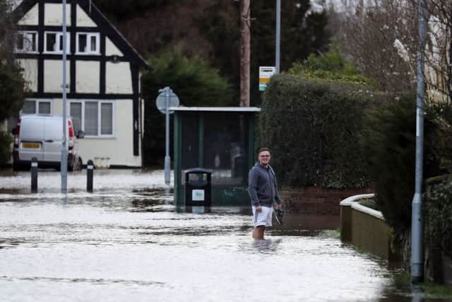 A man wades through flood water in Hereford. Picture: Steve Parsons/PA Wire