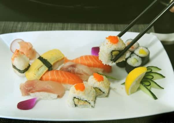 Sushi and sashimi  set, an assortment of mixed Nigiri and Maki sushi and sashimi