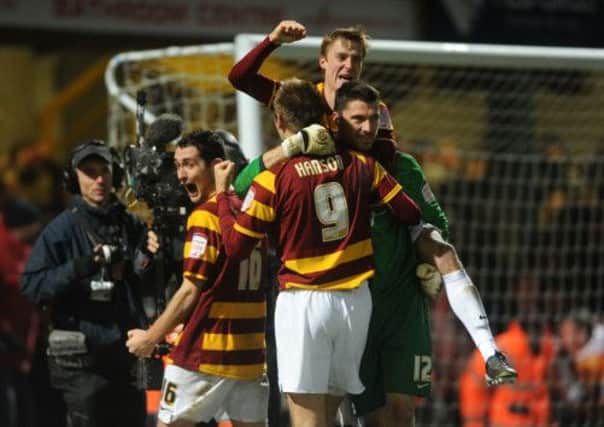 Bradford City celebrate beating Arsenal in the penalty shoot out last month.