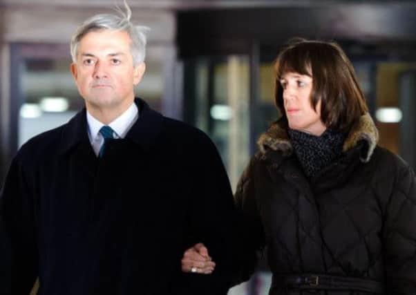 Chris Huhne and his partner Carina Trimingham leave Southwark Crown Court