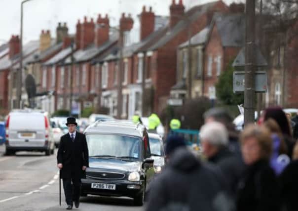 The hearse containing the coffin of Alan Greaves makes its way to St Saviour's Church in High Green, Sheffield, for his funeral.