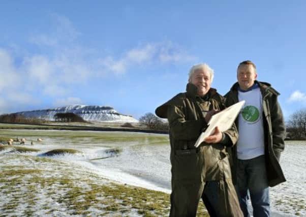 Artist Ashley Jackson with Mike Tomlinson at Pen-y-ghent for the launch of this year's Yorkshire Dales Walking Festival