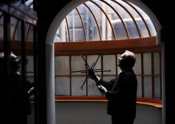 Collector David Usborne with a Swift, used in lace making.