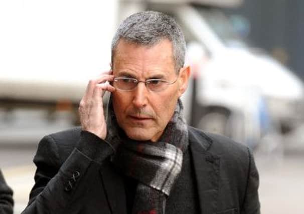 Uri Geller arrives at the High Court to hear his settlement claim against News Group Newspapers.