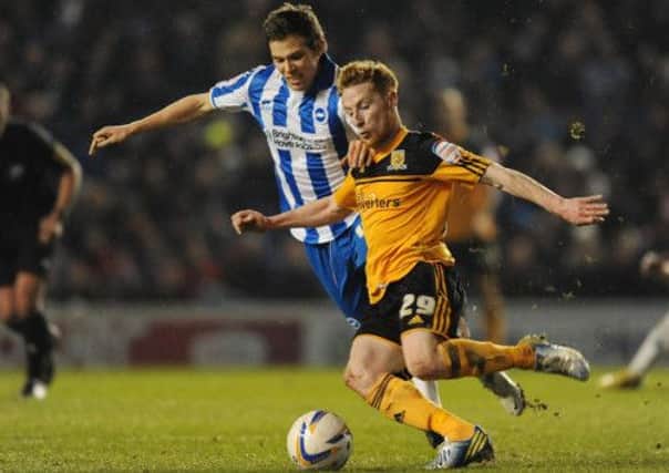Dean Hammond of Brighton & Hove Albion challenges for the ball with Stephen Quinn of Hull City.  Photo: Getty Images