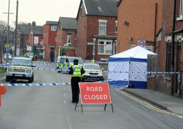 Police at the scene in Harehills, Leeds