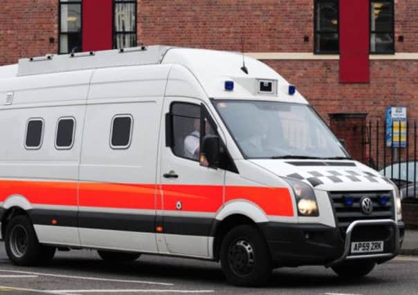 A prison van believed to contain Mick Philpott arrives at Nottingham Crown Court