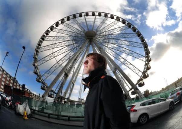 James McKenna from Leeds views the Big Wheel near Kirkgate Market.