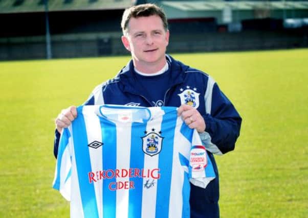 New Huddersfield Town manager Mark Robins takes charge of his first game against Wigan in the FA Cup.